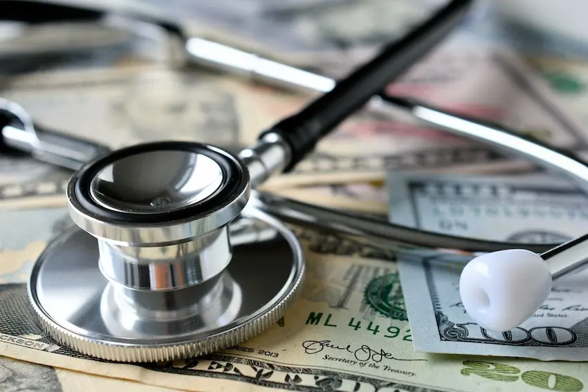 Settlement check from car accident case covering hospital bills and resolving medical debt without lawsuit